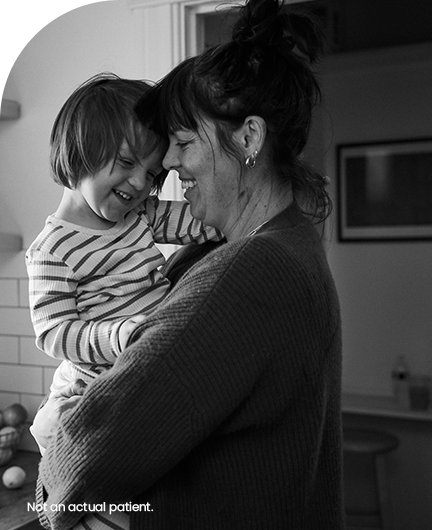 Person holding child in their arms